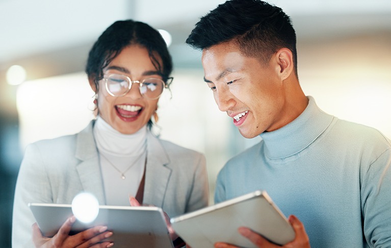 Friends,-collaboration-and-happy-with-work-on-tablet